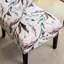 Fauteuil en tissu imprimé avec motif floral mauve - Espace de vie moderne, assise confortable et sans accoudoirs