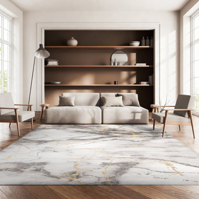 Tapis gris et or à motif abstrait Swindle