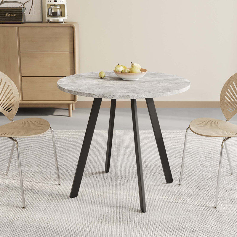 Versatile Circular Dining Table with Industrial Appeal for Various Settings