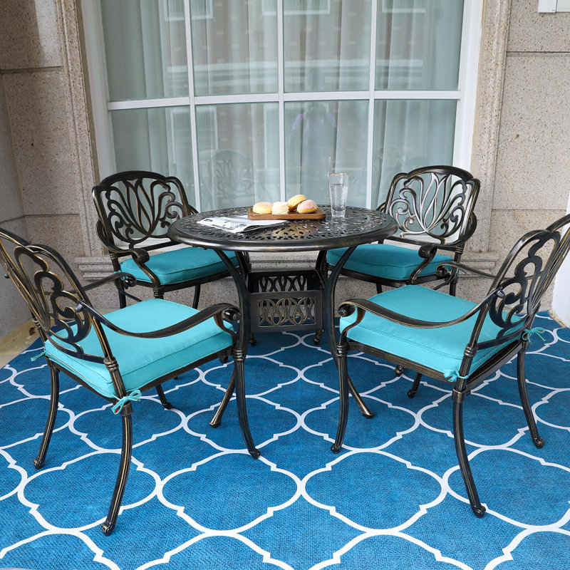 4 - Person Patio Dining Set Umbrella Hole Included Round Table with Cushions Included, Ocean Blue