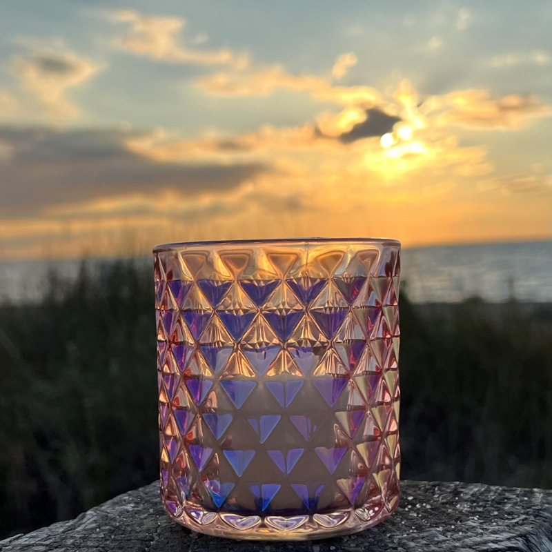 Bougeoirs en verre rose irisé
