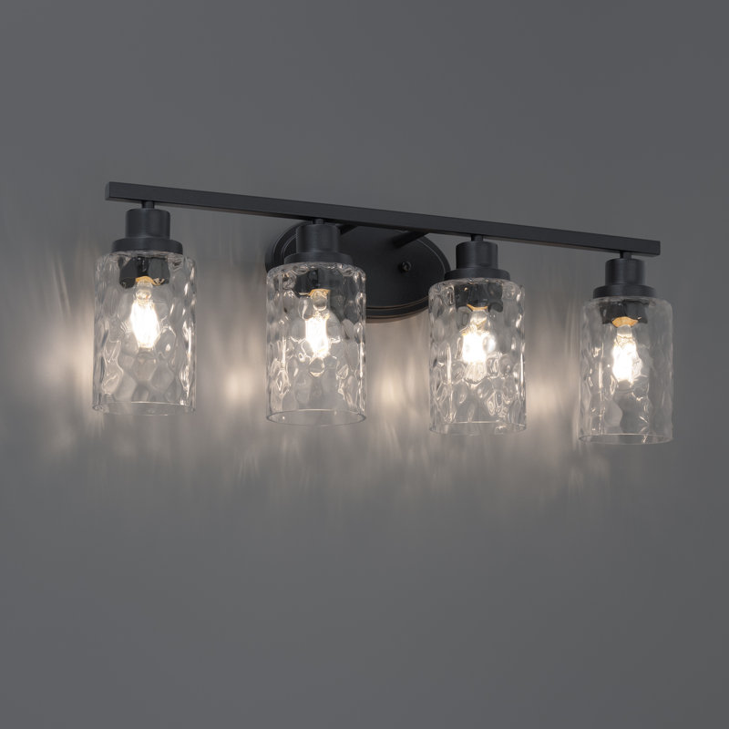 East Grove Home Builder Essentials Heritage Collection 25in 4-Light Bathroom Vanity and Wall Light with E26 Base Sockets (Lamps Sold Separately) and Hammered Glass in Matte Black