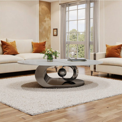 Table basse contemporaine ovale en faux marbre avec base sculpturale en acier inoxydable - Pièce maîtresse de luxe industriel