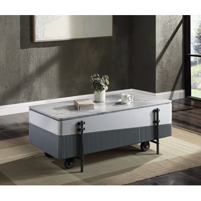Table basse grise et à finition ultrabrillante avec plateau relevable