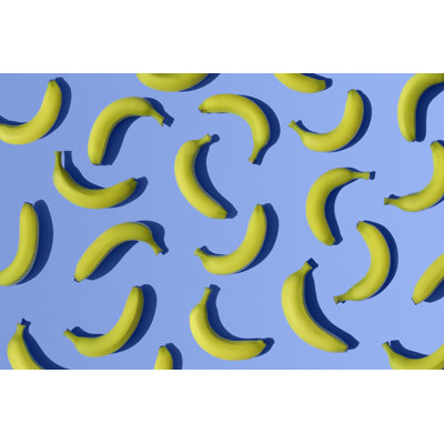 Bananas On Blue Background by Melecis - Wrapped Canvas Print