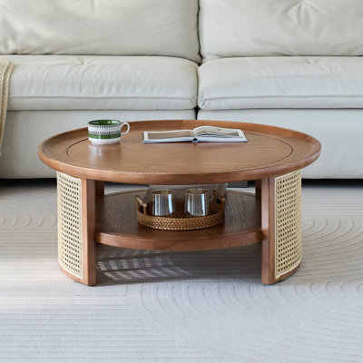 Table basse en bois massif avec tablette de rangement et base en rotin Cayslee