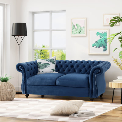 Deep Button In Navy Blue Velvet For A Cozy Seating Option Style Your Living Room