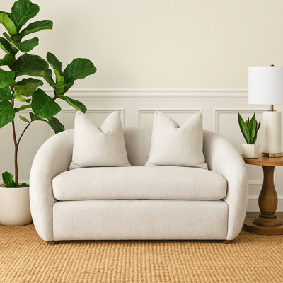 Canapé blanc capitonné avec 2 coussins, tissu motif plage, ressorts sinueux, assise réversible, mousse de rembourrage densité 1,8, largeur 89 cm, poids 46 kg, hauteur 76 cm, profondeur 165 cm.