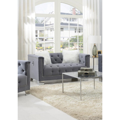 Gray Loveseat W/Two White Fur Pillows