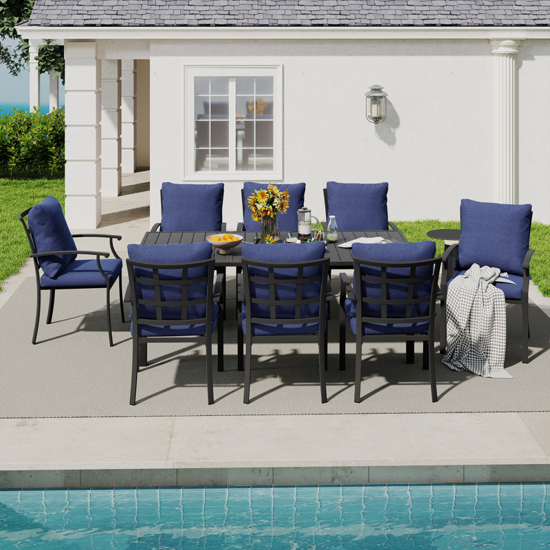 Ensemble repas de patio en métal noir 9 pièces avec table rectangulaire et coussins bleus Maynard, Bleu
