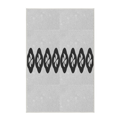 Tapis gris/crème tissé à la machine