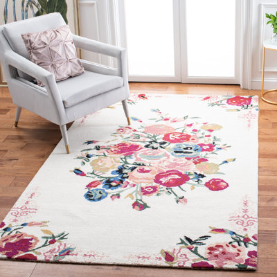 Tapis floral rose / rouge / ivoire en laine / coton touffeté à la main Delmarie