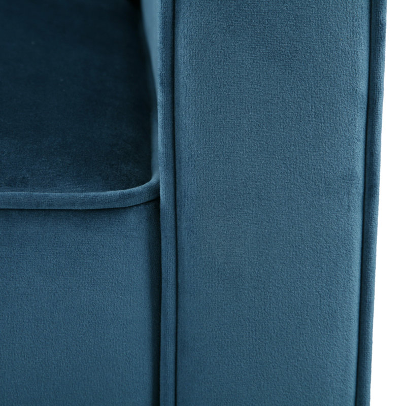 Fauteuil club en velours bleu