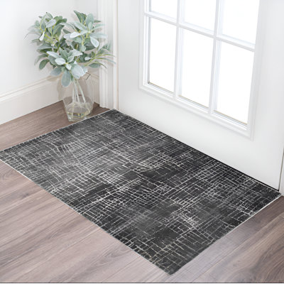 Tapis gris à motif abstrait