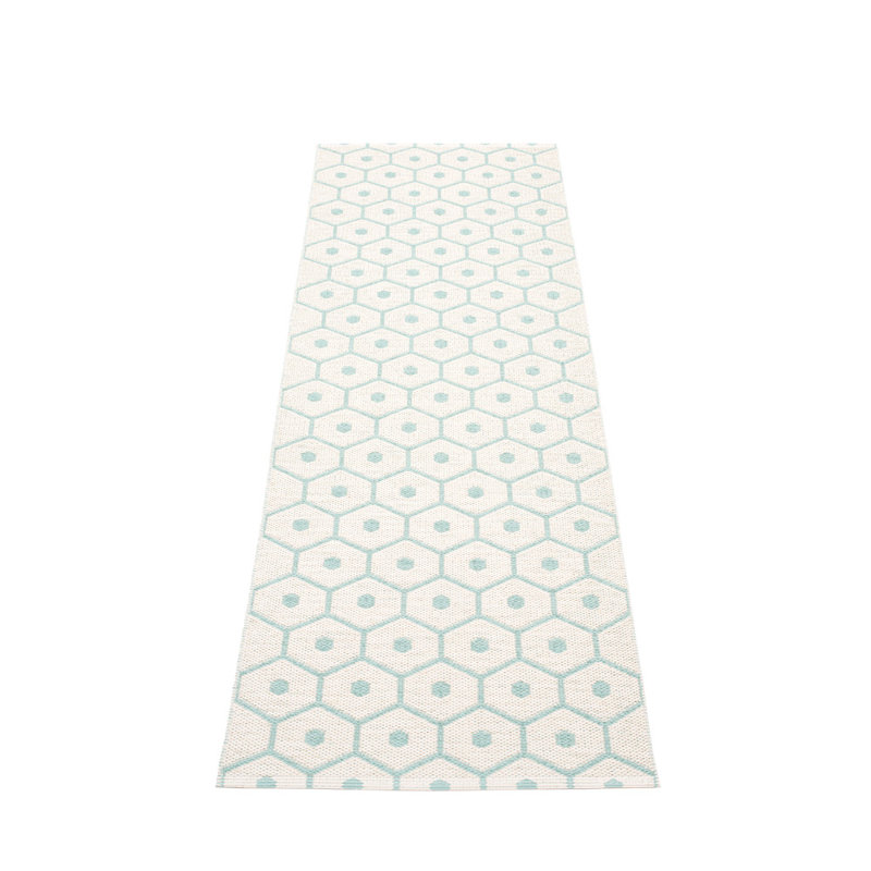 Tapis turquoise / blanc miel pâle
