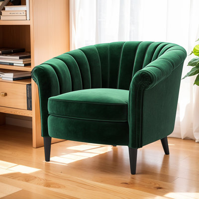 Fauteuil en velours vert foncé