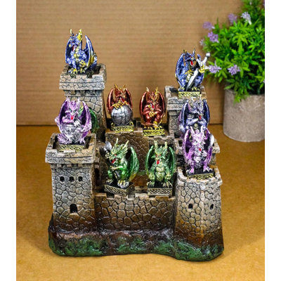 Figurine médiévale avec 12 petits dragons