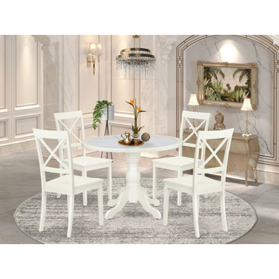 L'ensemble de salle à manger 5 pièces se compose d'une table ronde et de 4 chaises de salle à manger en bois avec dossier en X - Lin blanc