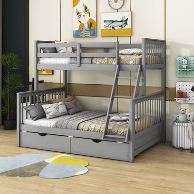 Lit superposé simple au dessus d'un lit double en bois avec 2 tiroirs