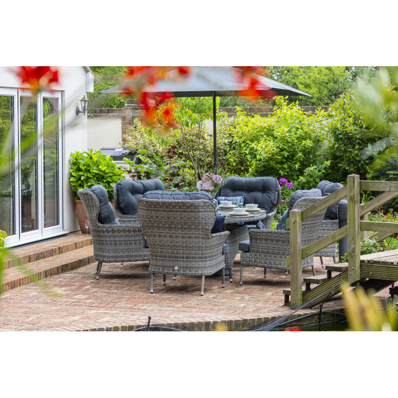 Raeburn 6 - Person Wicker Patio Dining Set with Oval Table , Cushions Included, Grey, Grey