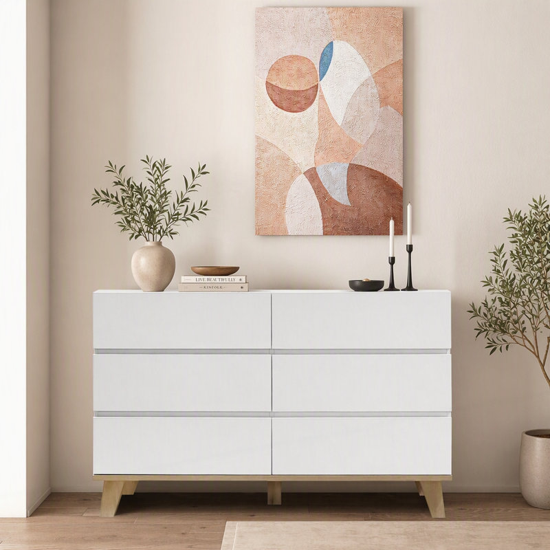 Commode blanche minimaliste à 6 tiroirs avec pieds en bois massif, conception sans poignée