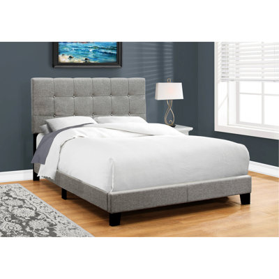Lit double tapissier gris pour une chambre à coucher confortable
