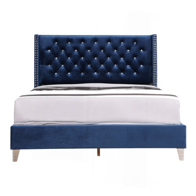 Élégant grand lit tapissier bleu marine