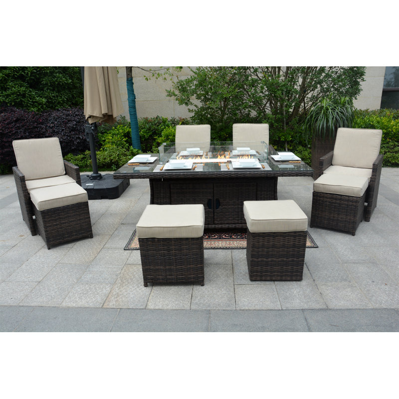 Phibbs 4 - Person Wicker Patio Dining Set with Rectangular Table , Cushions Included