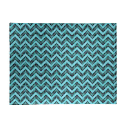 Tapis bleu/noir à chevrons à main inversé