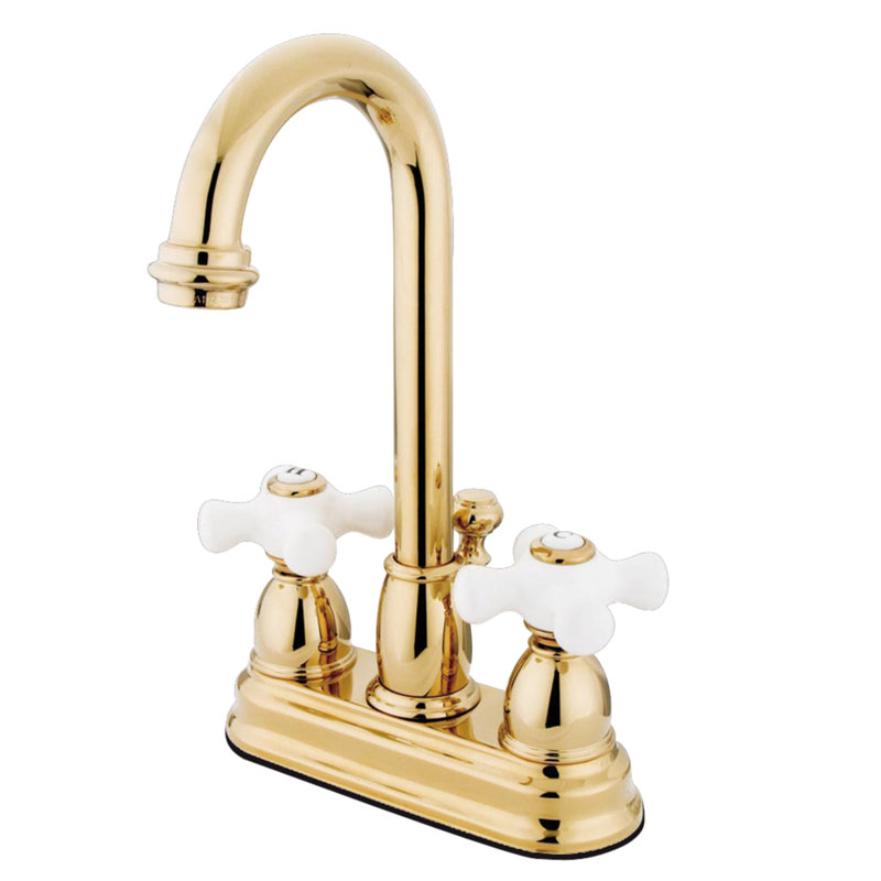 Kingston Brass Restoration Two-Handle 3-Hole Deck Mount 4" Centerset Bathroom Faucet with Plastic Pop-Up, Polished Brass