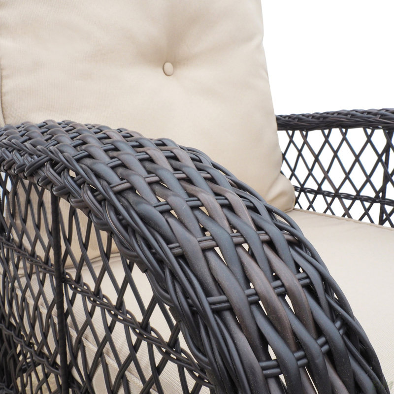 Chaise berçante d'extérieur en rotin avec coussins