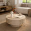 Table basse ronde de rangement avec finition beige travertin, couvercle amovible et rangement dissimulé