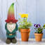 Statue de gnome tanner avec chapeau fleur