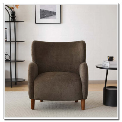 Fauteuil club à oreilles en velours