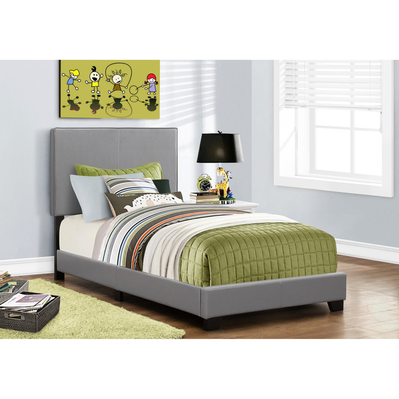 Lit simple en similicuir gris pour un cadre de chambre confortable et chic, convient à différentes chambres