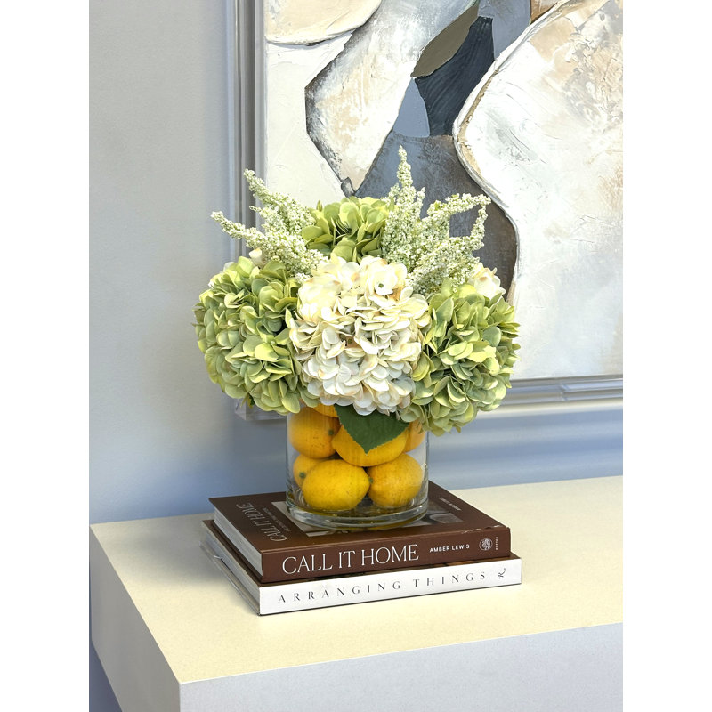 Hydrangeas Arranged in Glass Vase with Lemons