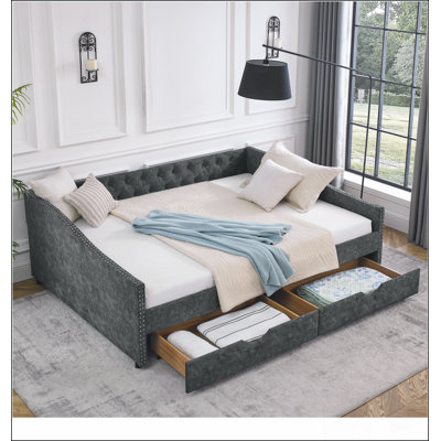 Lit de jour capitonné d'inspiration Mid-Century avec lit gigogne et rangement, parfait pour les espaces de vie élégants et fonctionnels.