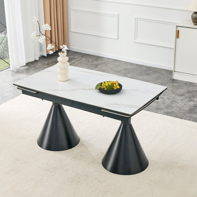 Extendable Stone-Top Dining Table: White marble-patterned tabletop with black tapered metal legs. A modern, luxury-inspired rectangular dining table f