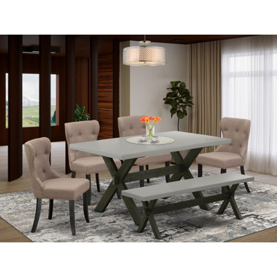 L'ensemble de table de salle à manger 6 pièces contient une table rectangulaire en bois avec des pieds en X et 4 chaises rembourrées en tissu de lin avec un banc, noir brossé