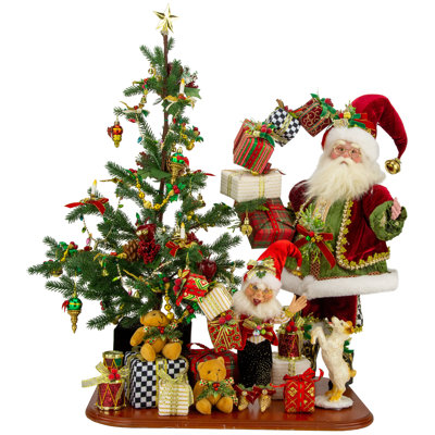 Père Noël et elf de Noël offrant un cadeau