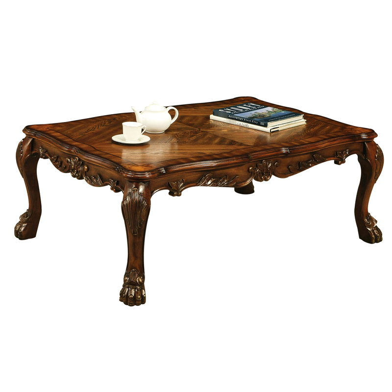 Table basse en chêne cerisier de style rétro avec pieds griffes et plateau de table