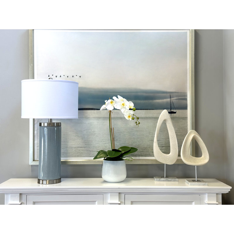 Orchid Arrangement In A Glass Vase With Orchid Leaves And Moss