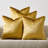Set of 4 gold velvet square throw pillow covers in a stacked arrangement