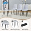 Ensemble de table et de chaises. Une table de salle à manger rectangulaire rétro minimaliste de 55 pouces avec un dessus texturé noir. Assortie à 4 chaises de salle à manger en lin et coton gris clair à haute résilience avec pieds en métal.