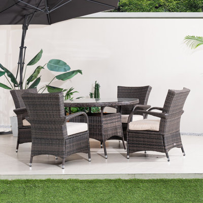 Ensemble de salle à manger de patio en osier pour 4 personnes avec table ronde Ashley, coussins inclus