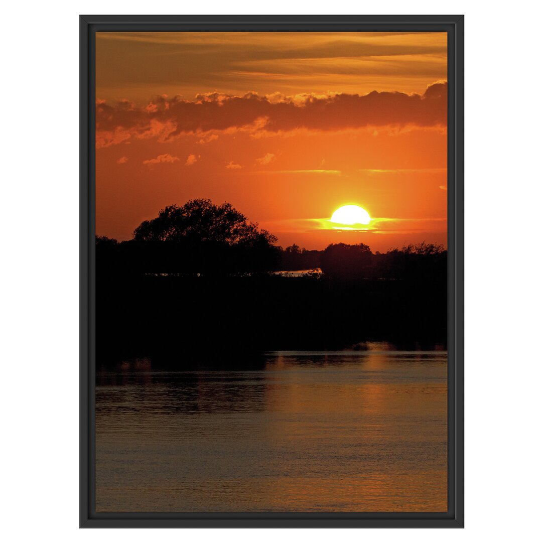 Gerahmtes Wandbild Sonnenuntergang über Fluss