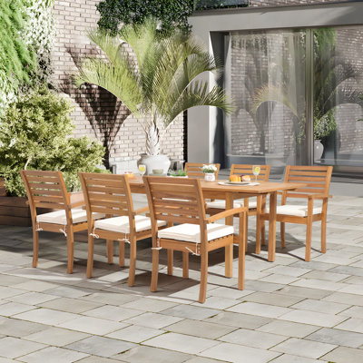 Kilani 6 - Person Acacia Wood Patio Dining Set with Extendable Rectangular Table , Cushions Included