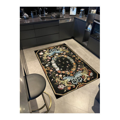 Tapis décoratif noir à motif géométrique lavable