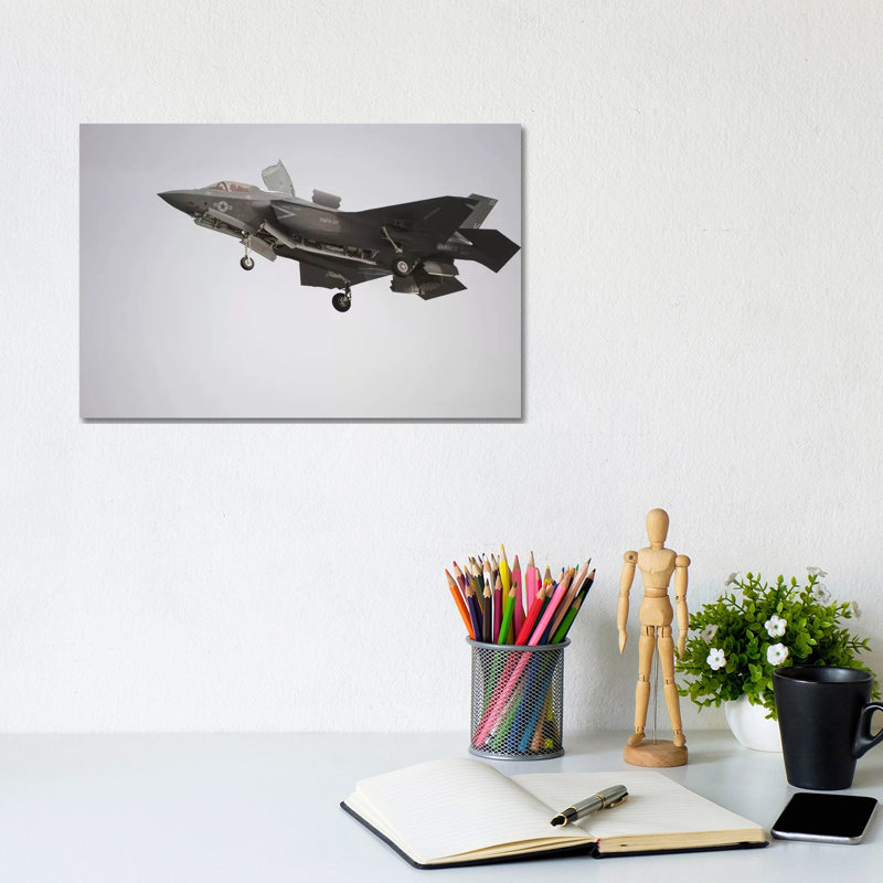 An F-35B Lightning II Joint Strike Fighter Prepares To Make A Vertical Landing by Stocktrek Images - Wrapped Canvas Print