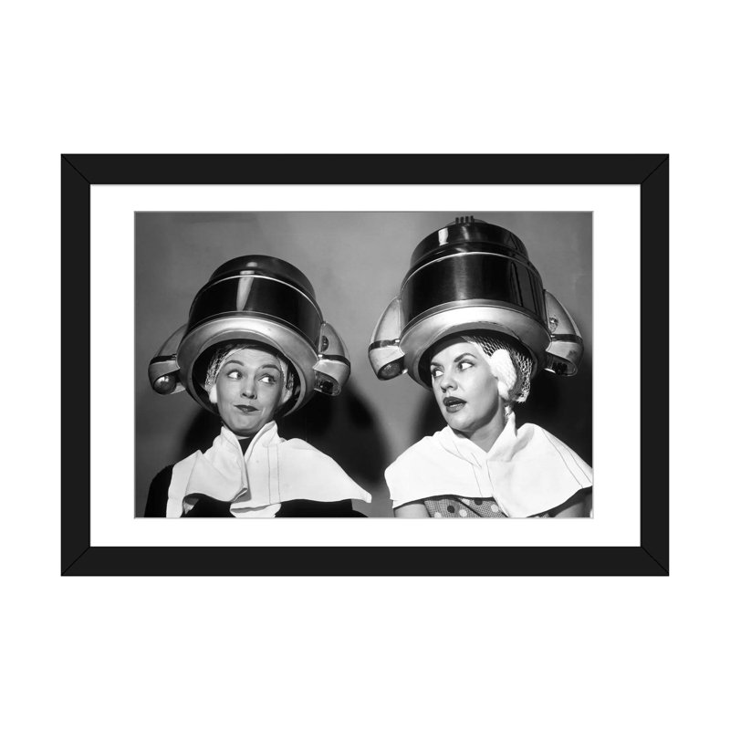 " 1950s Two Women Sitting Together Gossiping Under Hairdresser Hair Dryer " by Vintage Images, Black Framed Fine Art Paper
